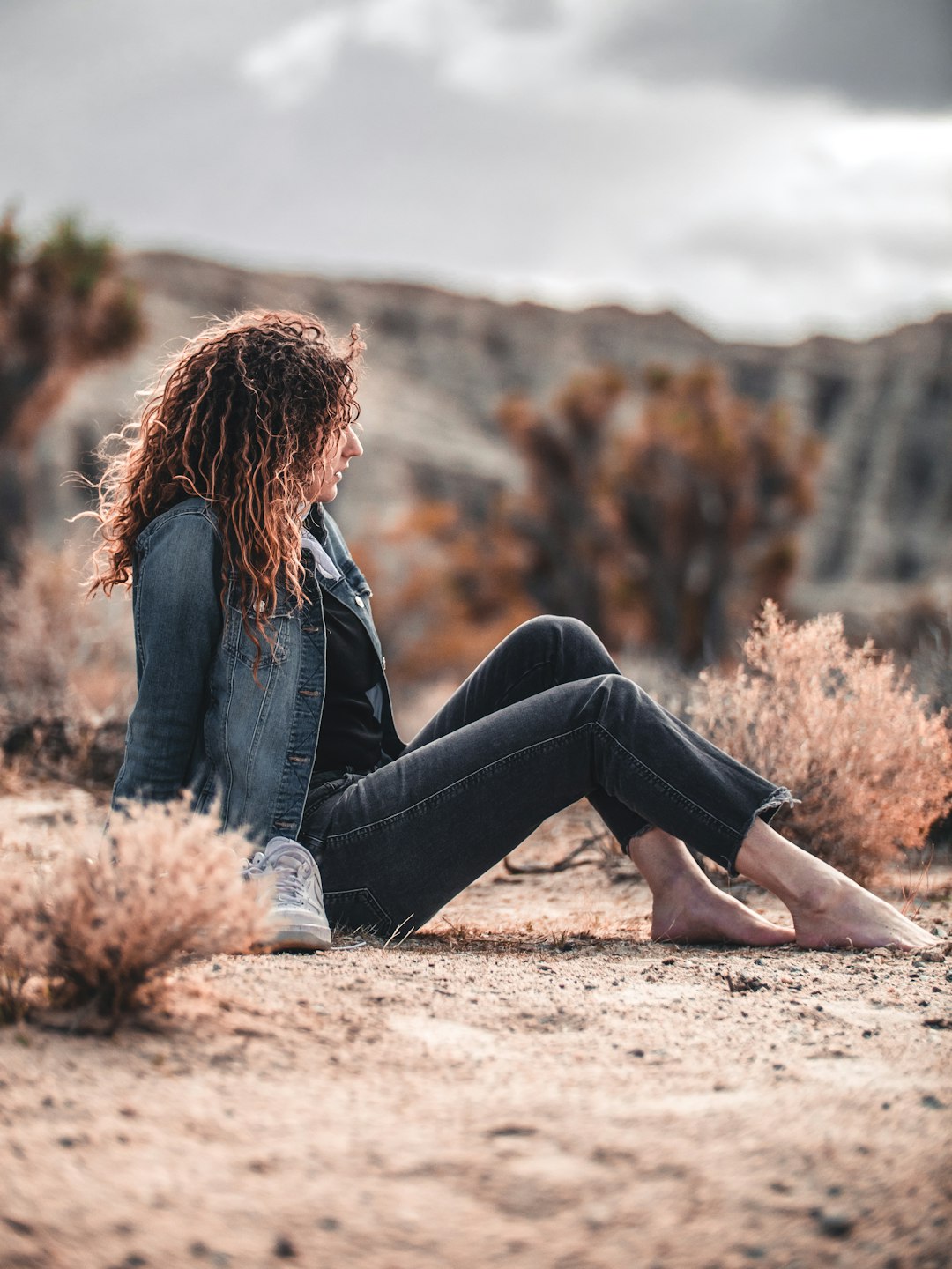 woman sitting on brown soil