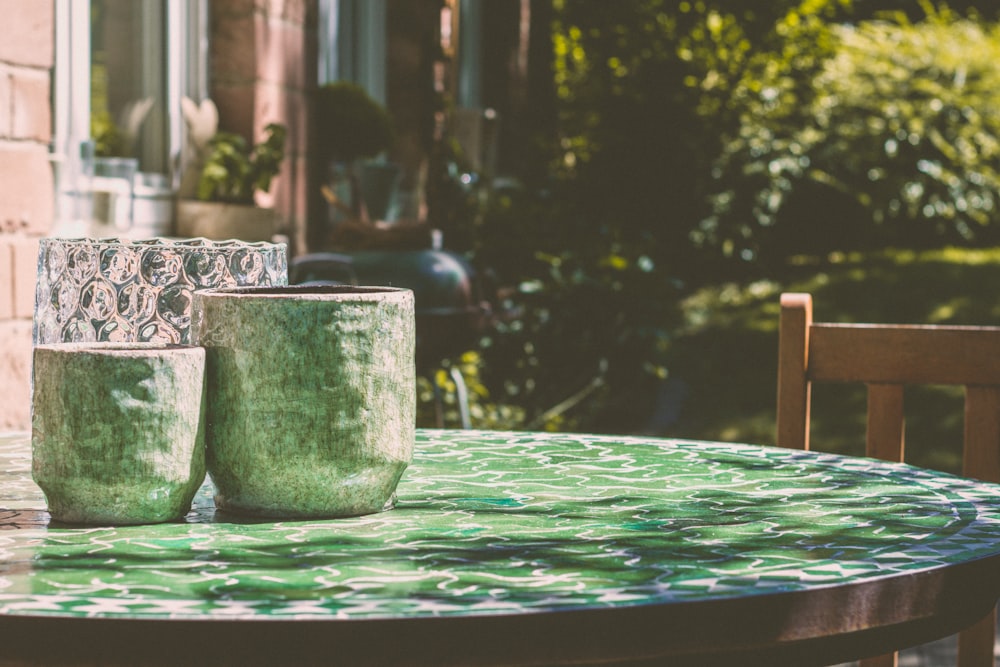 selective focus photography of vases on table