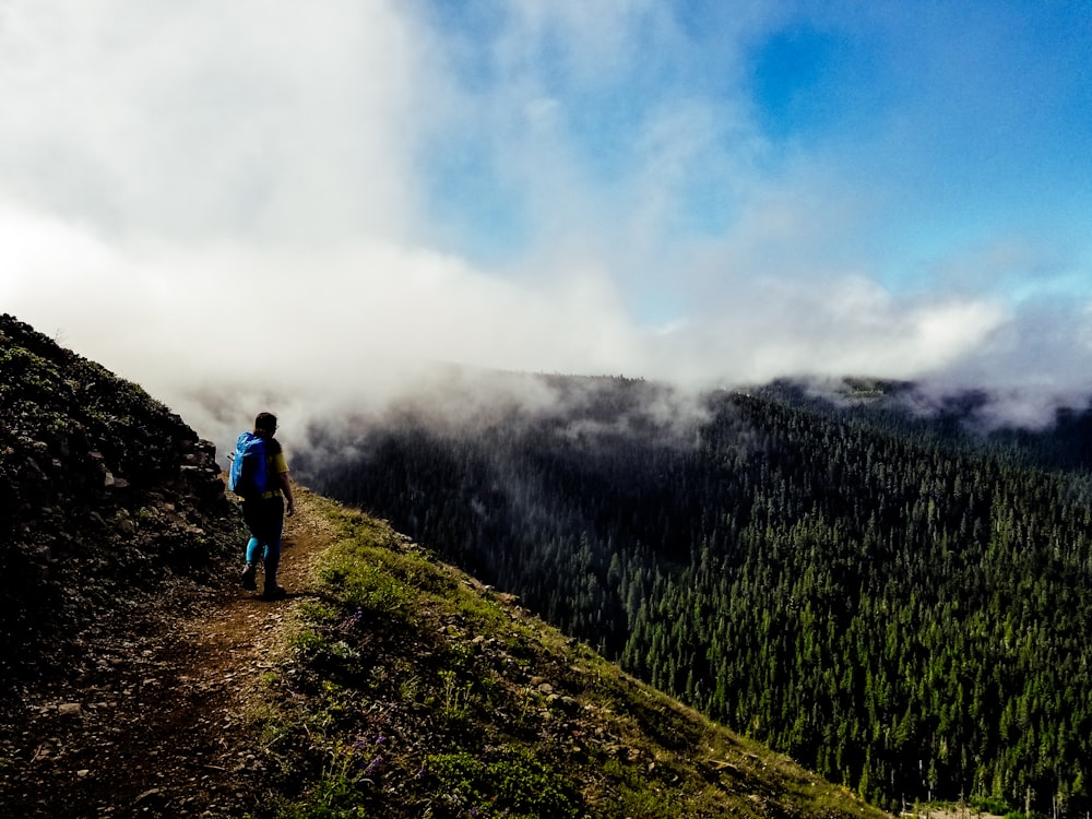 man standing on mountain