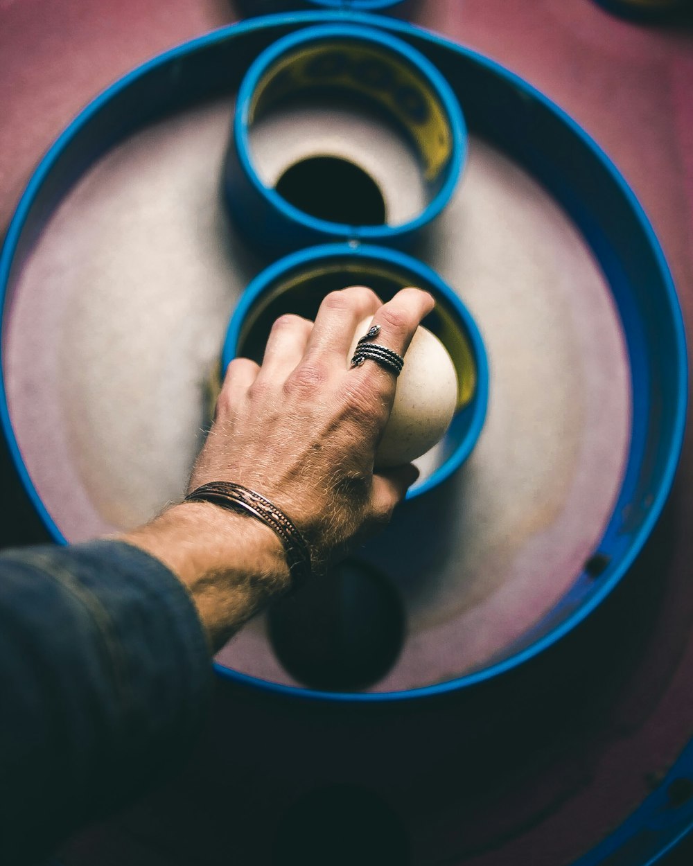 person holding white ball