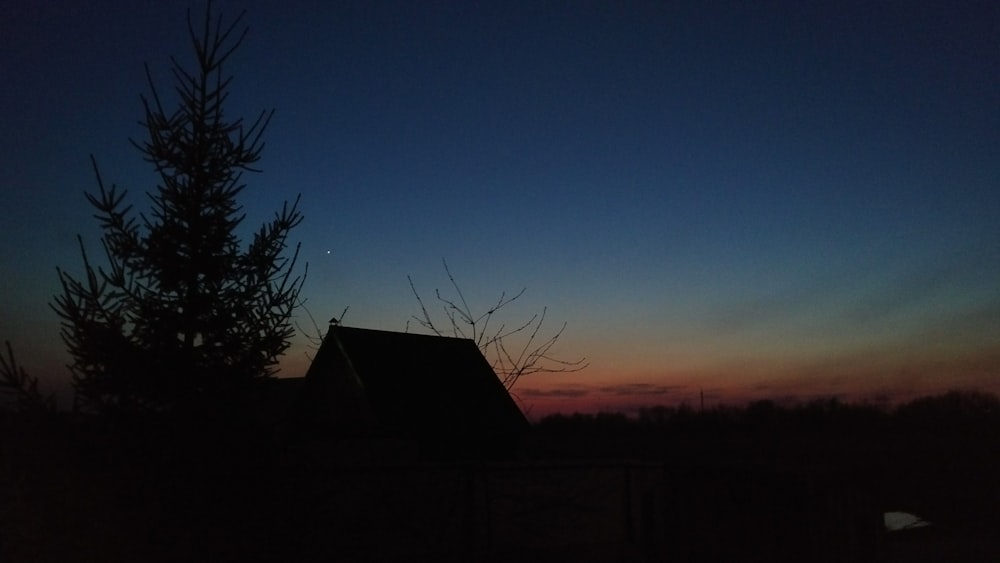 silhouette of house and tree painting