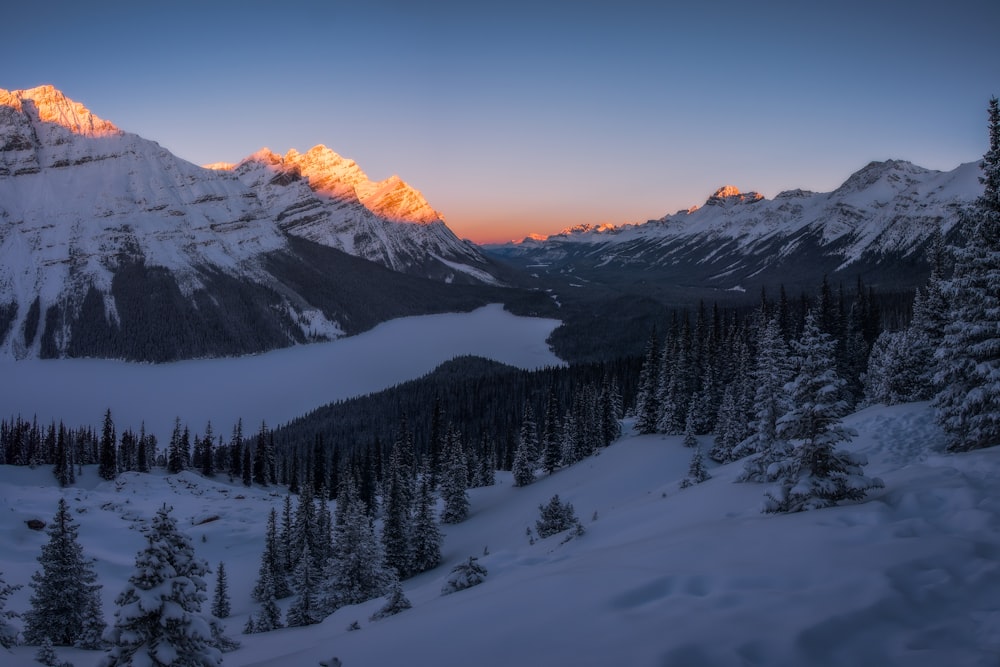 landscape shot of snowy mountain under blue sky