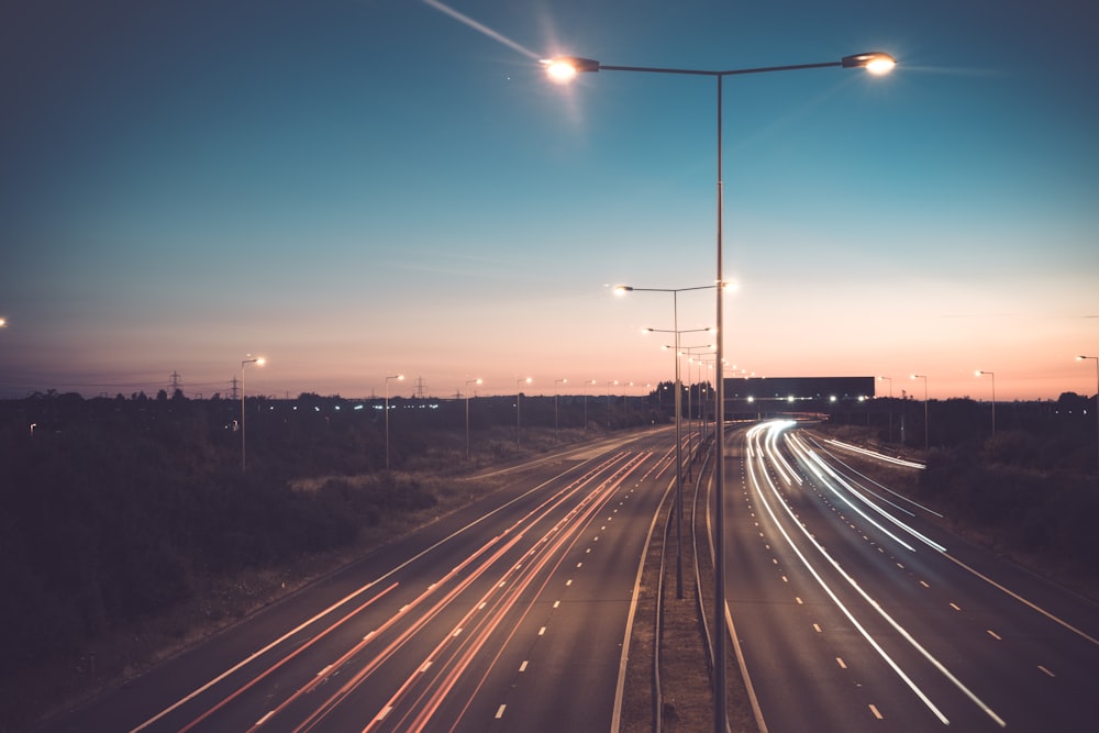 time-lapse photography of road during blue hour