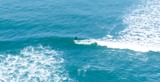 man surfing on body of water during daytime in Lima Region Peru