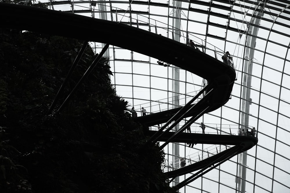 photo of silhouette roller coaster rails indoor