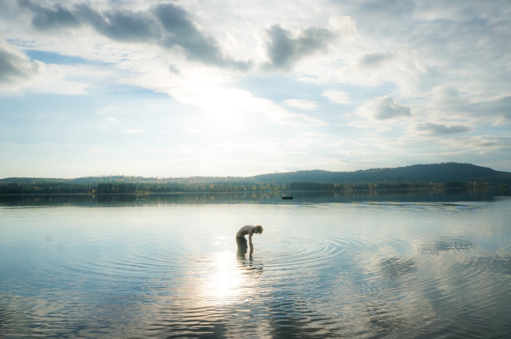 person standing on body of water