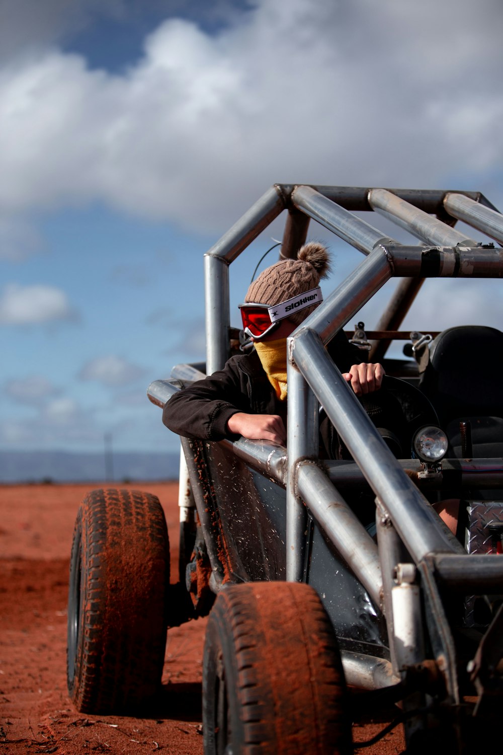 person riding gray motor buggy