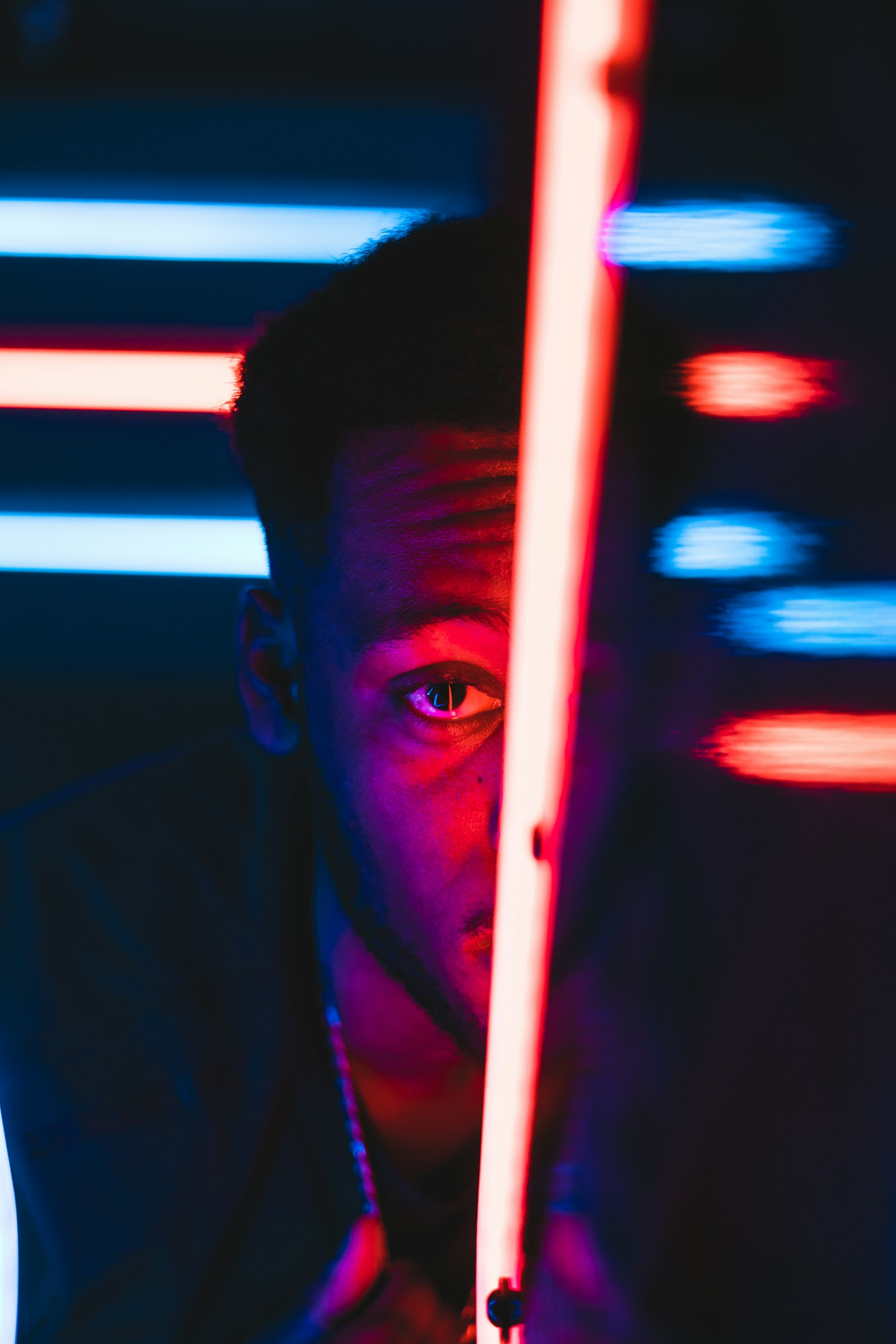 Sony a7R II + Sony FE 50mm F1.8 sample photo. Man peeping on red photography