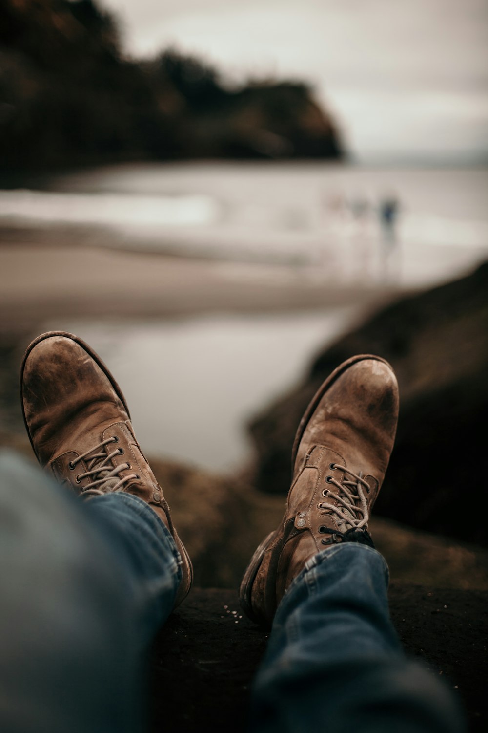 person wearing brown leather shoes