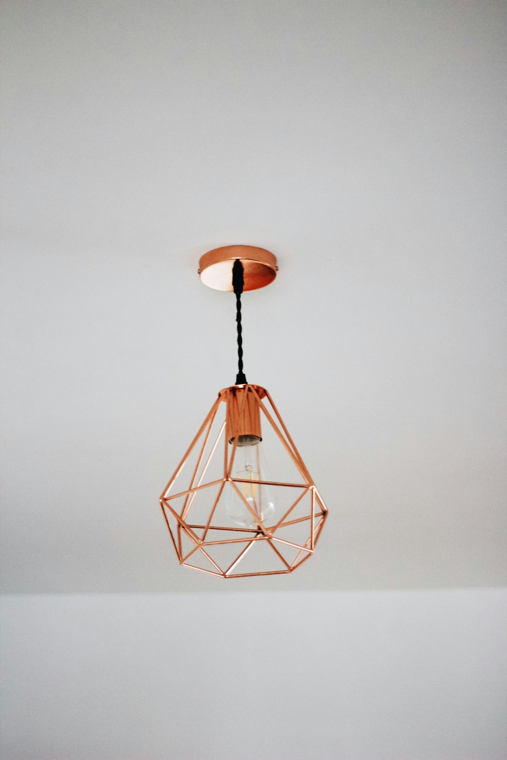 brown pendant lamp on ceiling