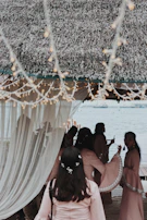 Guests enjoying a traditional feast under a canopy of twinkling fairy lights in Hampi.
