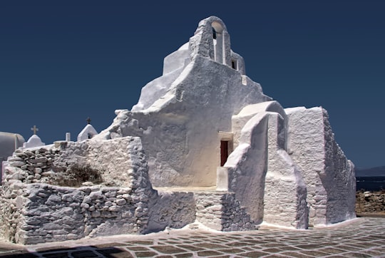 white concrete building under blue sky in Mykonos Greece