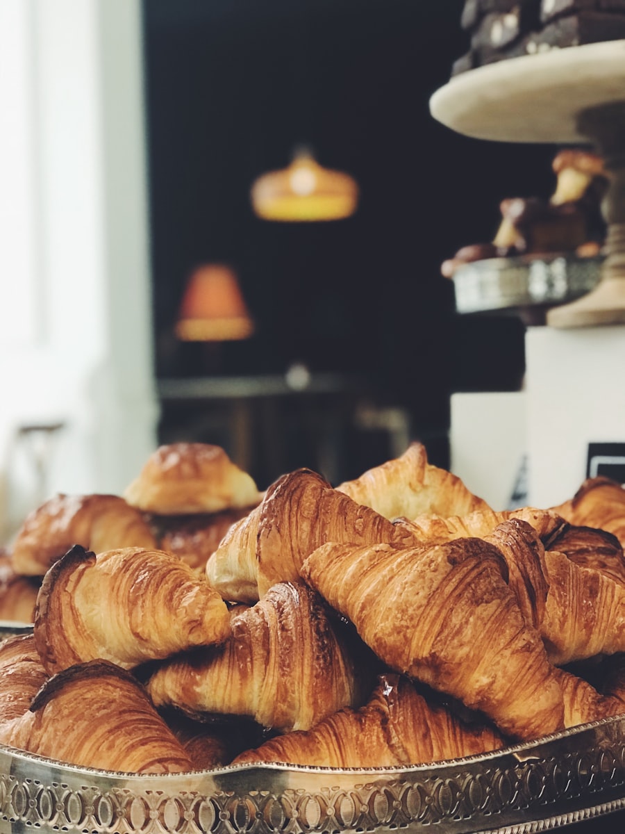 A tray piled with deeply golden laminated butter pastries