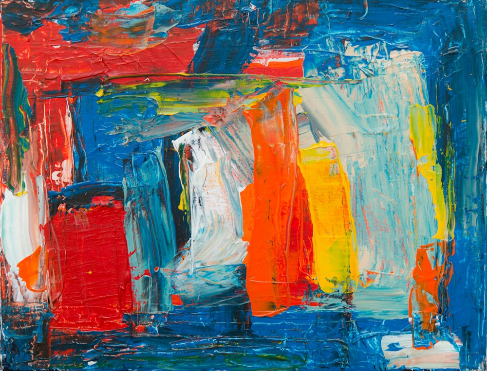 red, yellow, white, and blue abstract painting