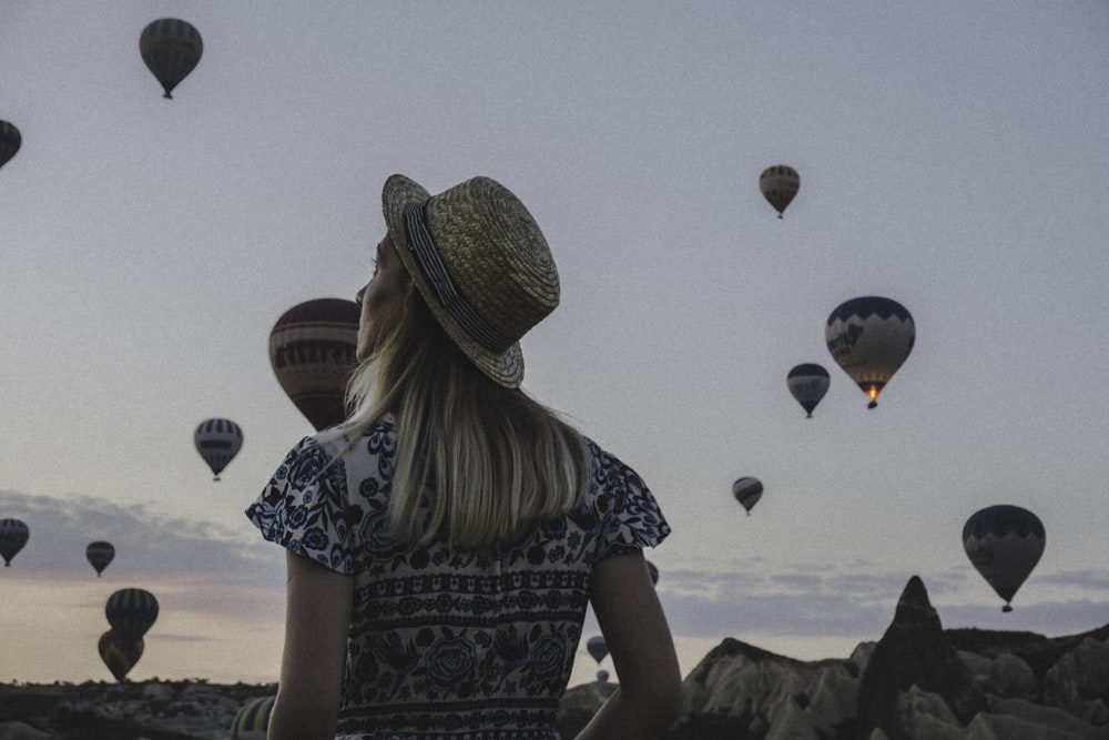 woman watching hot air balloons