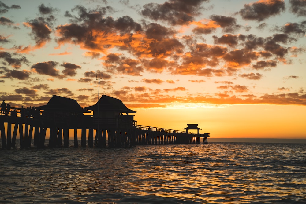 silhouette of dock during golden hour