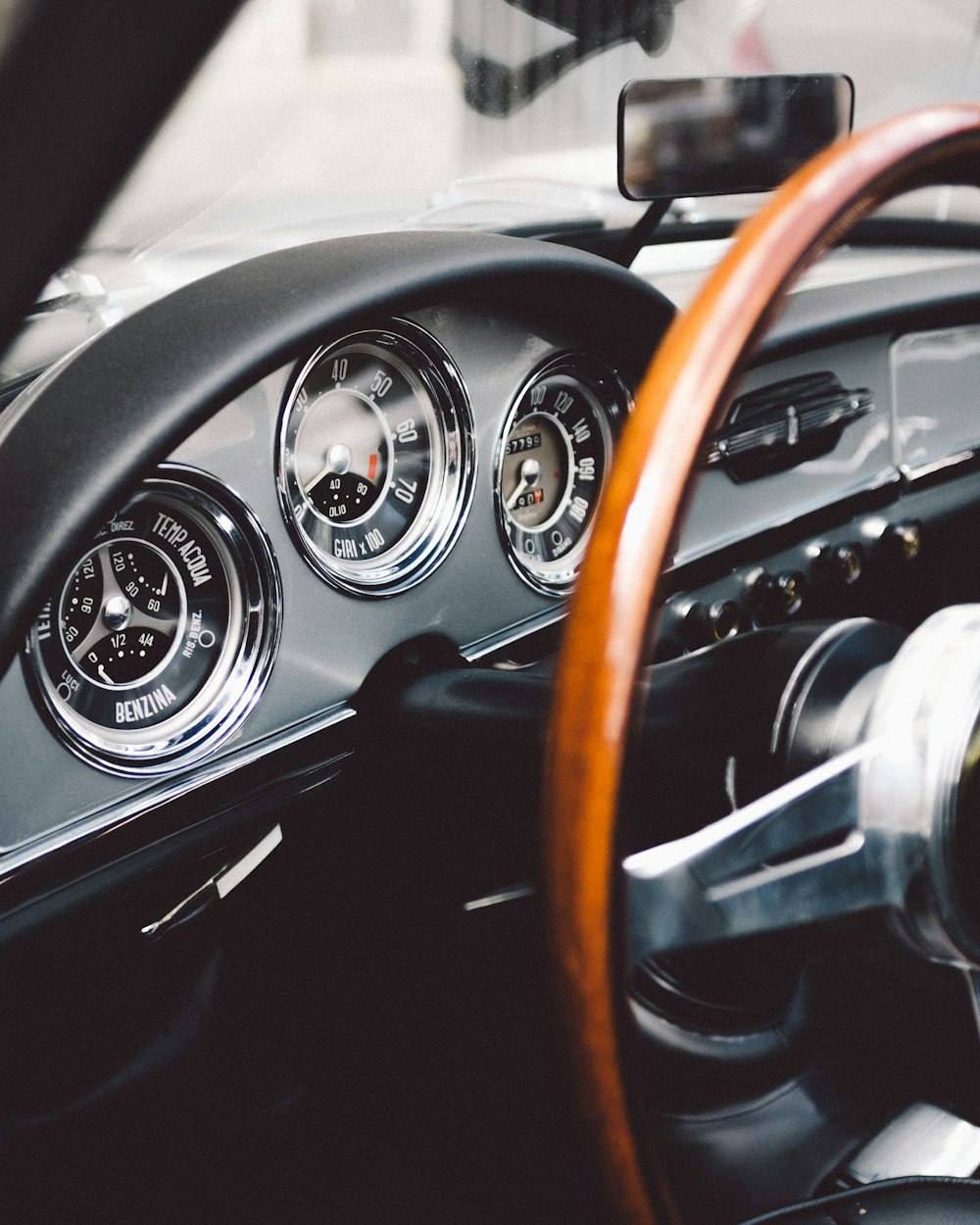 focus photography of vehicle steering wheel