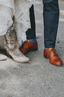 person wearing pair of brown leather dress shoes