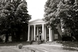 An institutional building with grand columns and a welcoming entrance.