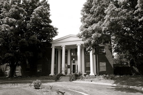 An institutional building with grand columns and a welcoming entrance.