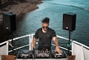 man holding mixing console