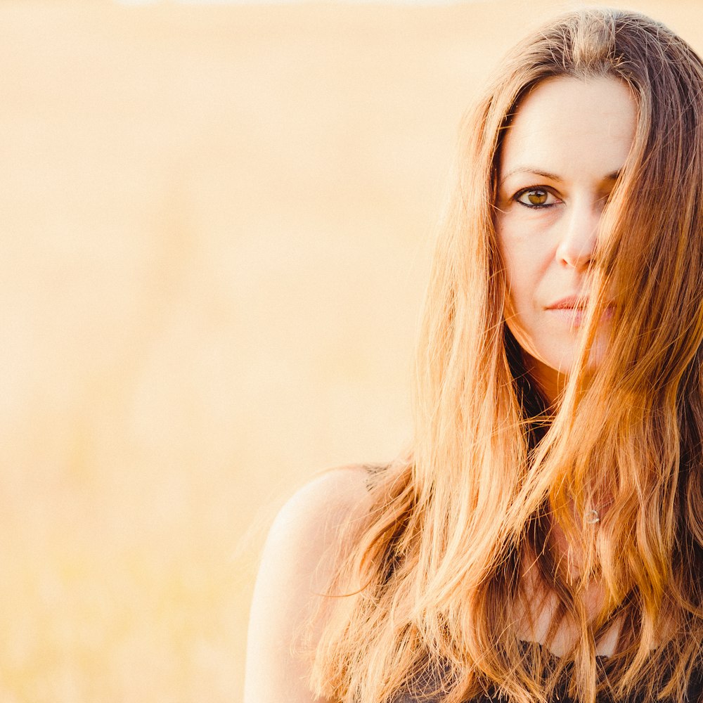 woman's hair covering half of face