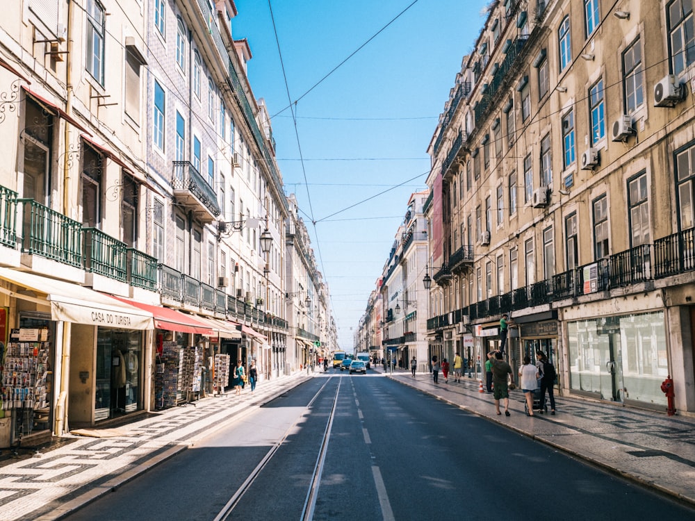 concrete road between buildings during daytime