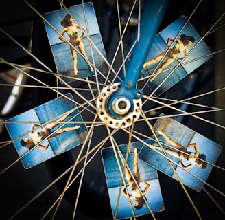 blue and grey bicycle wheel with photo of woman