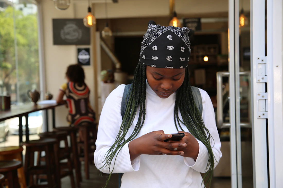 A woman checking her finances on a mobile phone