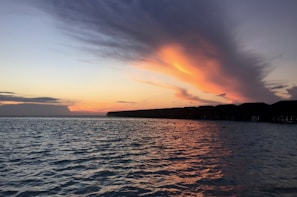 A stunning sunset over the crystal-clear waters of Vaavu Atoll.
