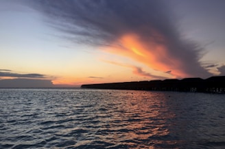 A stunning sunset over the crystal-clear waters of Vaavu Atoll.