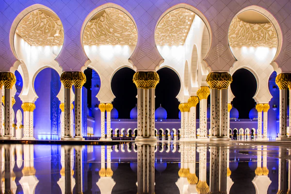 Illuminated arches reflected at Sheikh Zayed Grand Mosque