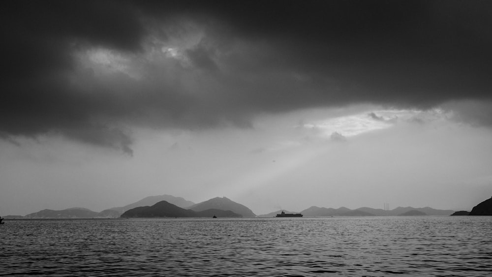 greyscale photography of wavy ocean