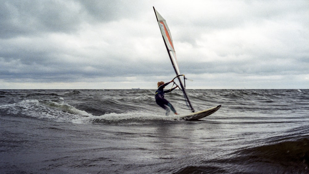 man on sailboat during daytime