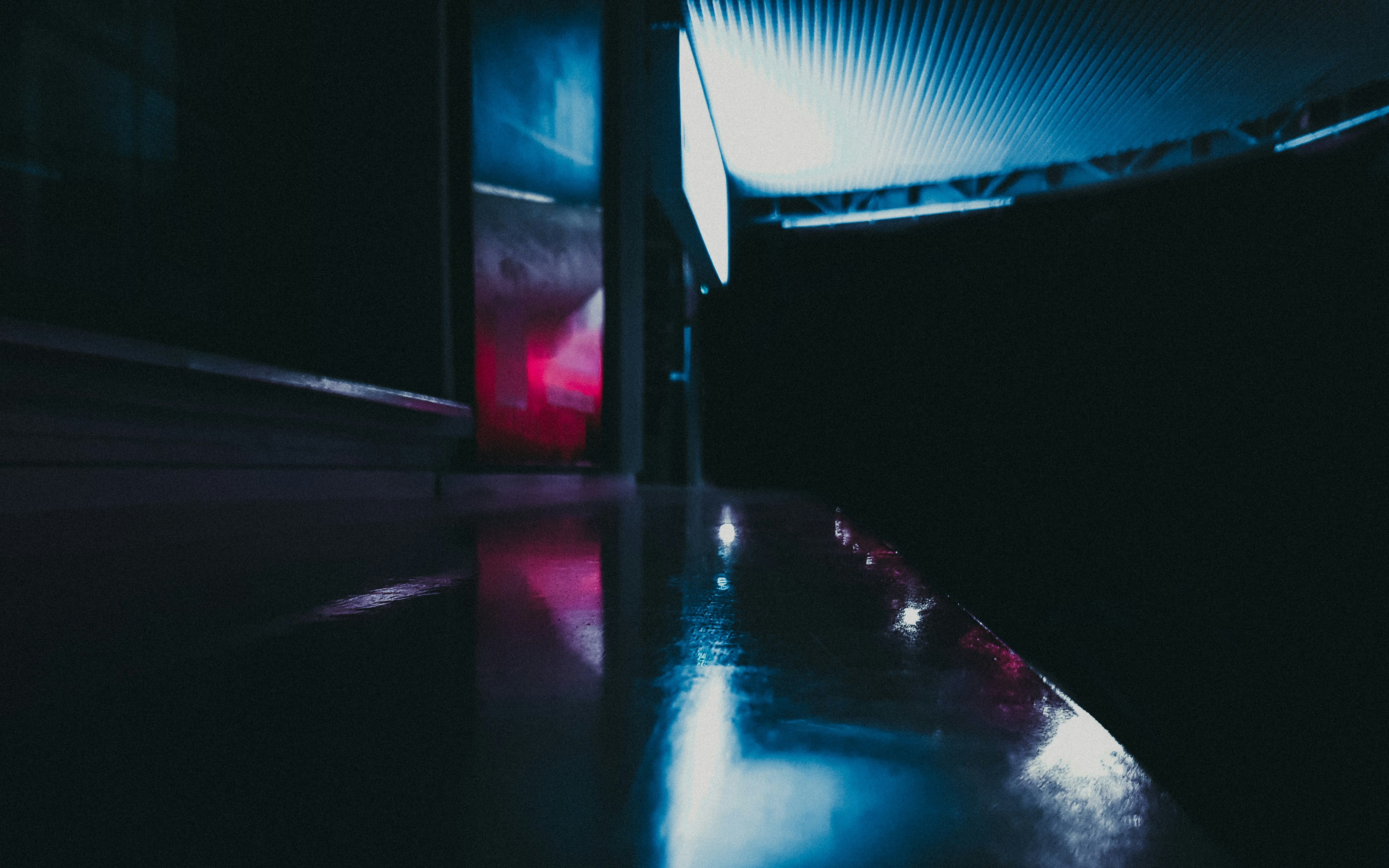 Immersive light installation corridor, colorful neon reflections, dark atmospheric space