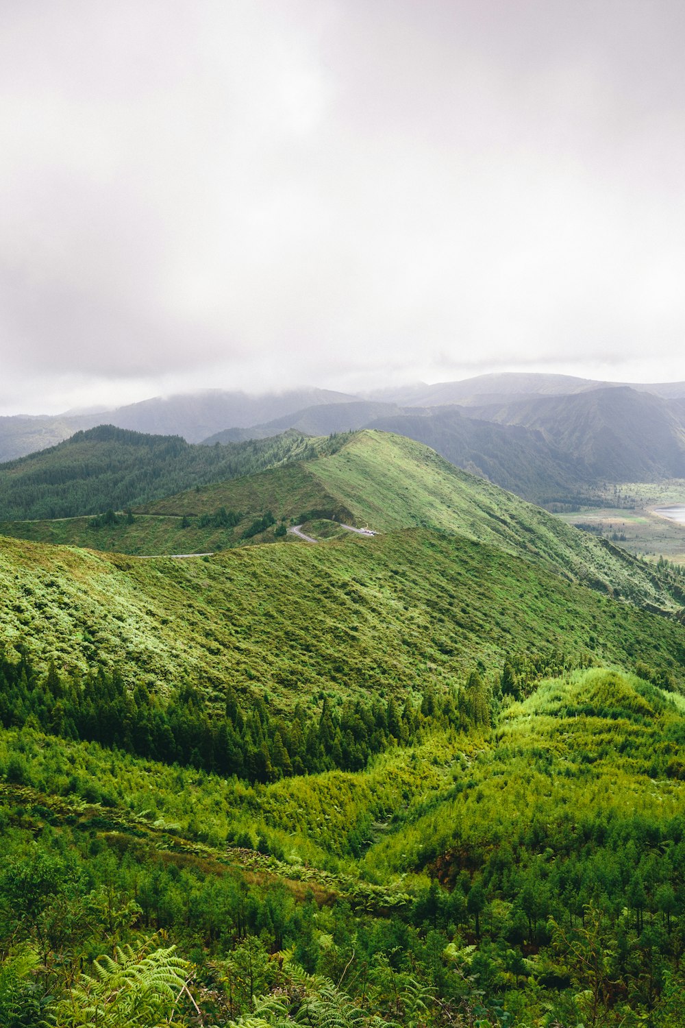 green mountain under heavy clouds