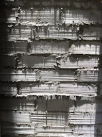 Lightweight concrete wall with a bold, textured print capturing vivid natural landscapes, bathed in soft lighting.