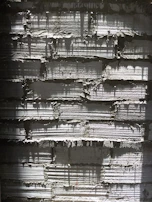 Detail of textured concrete blocks illuminated by natural light.