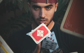 man throwing playing cards