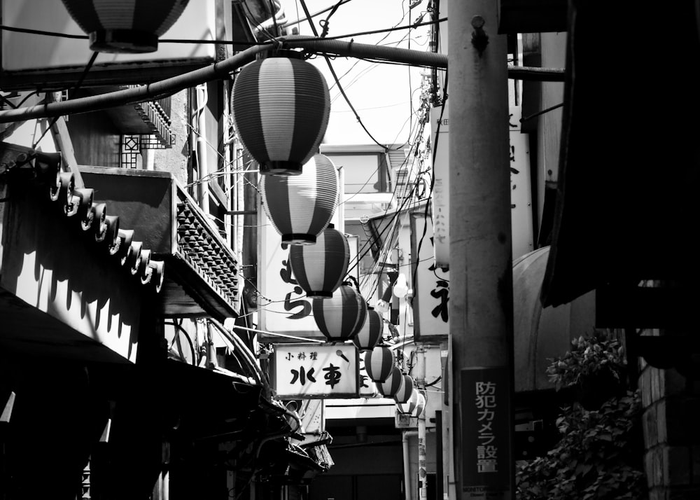 grayscale photography of lanterns