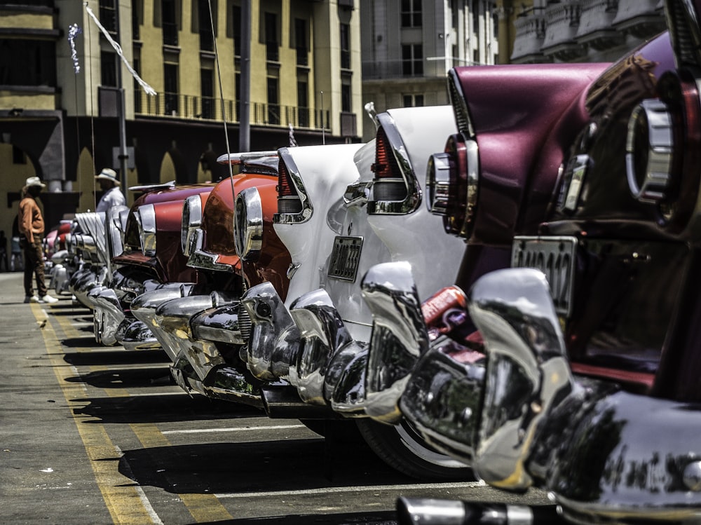 lined white, purple, and red vehicles