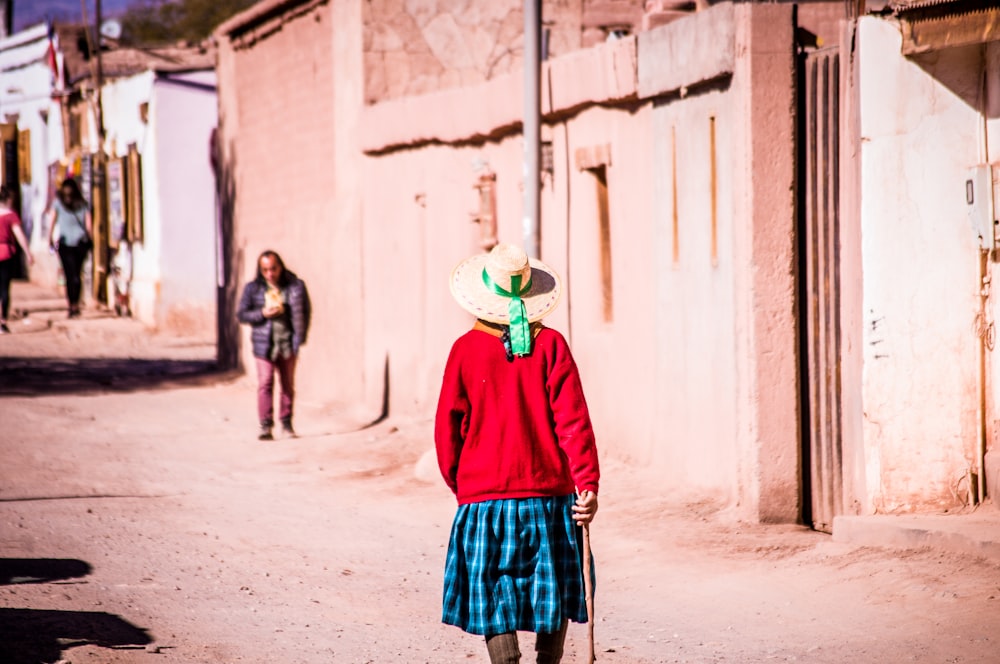 woman walking on gray road