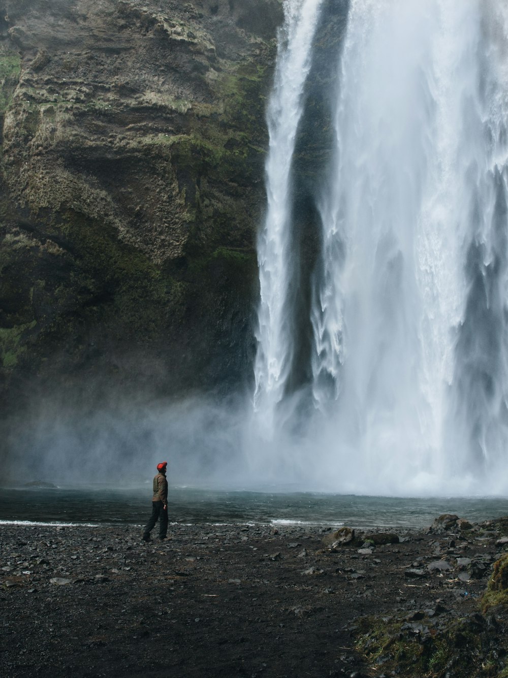 man near waterfalls