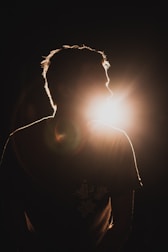 silhouette of sitting man looking to the right