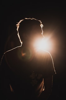 silhouette of sitting man looking to the right