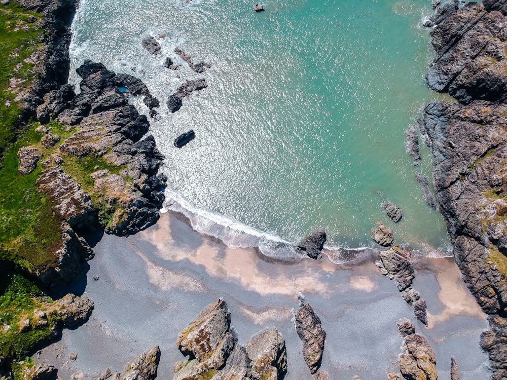 bird's-eye view photography of body of water near mountain