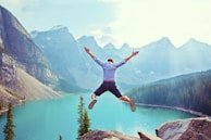 photo of man about to jump from cliff