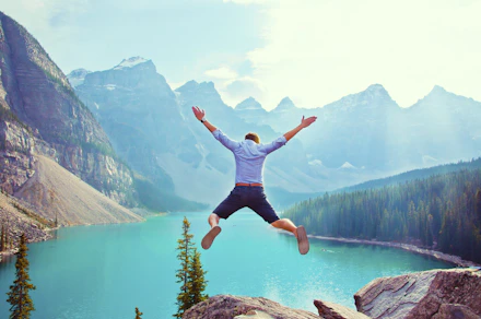 photo of man about to jump from cliff