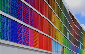 Colorful composite panel facade with varied shapes and textures.