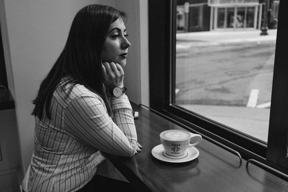 woman sitting beside table